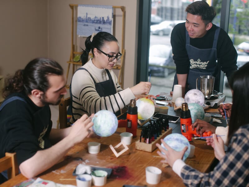 people in a lampshade making workshop